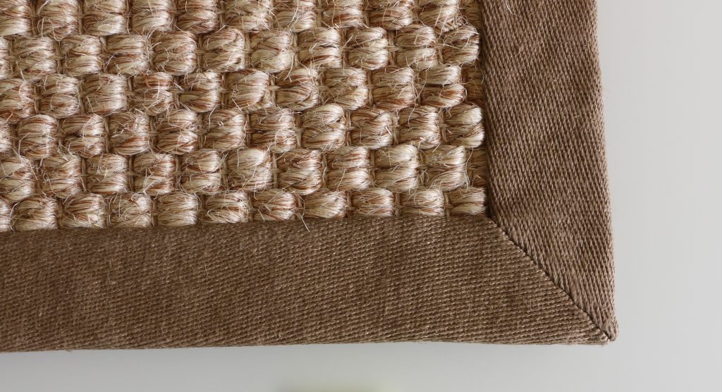 What is the difference of serging and binding edge on a rug
