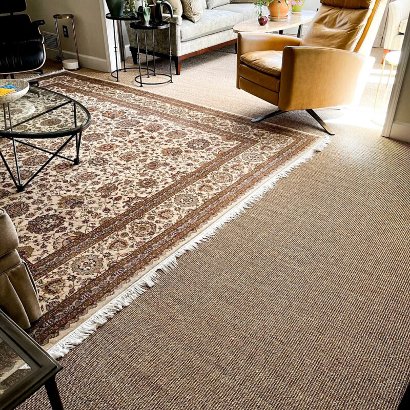 layered sisal rug and patterned rug