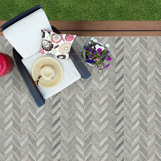 outdoor poly silk rug on wood deck