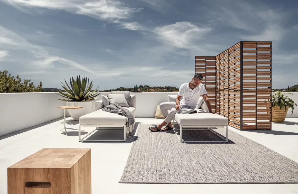daybeds on roof patio with synthetic outdoor rug