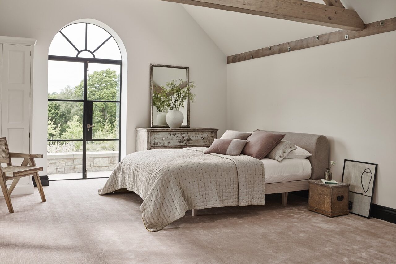 jacaranda's luxury carpet seoni in a bedroom